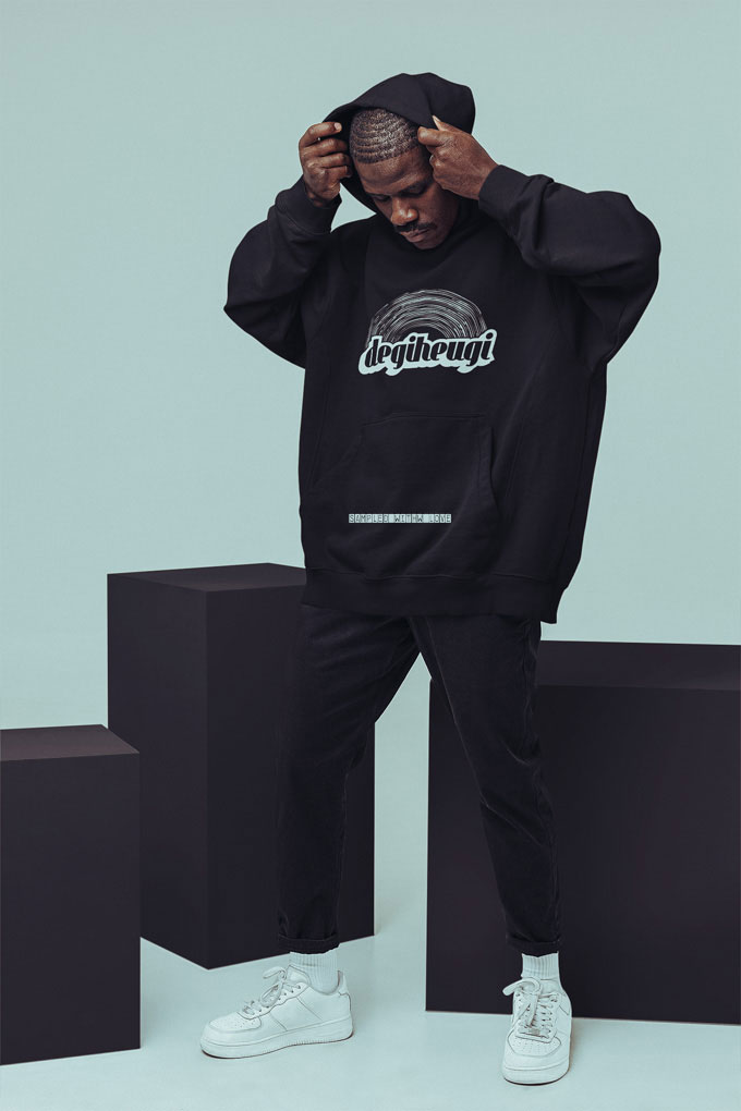 hoodie-mockup-featuring-a-man-posing-at-a-studio-with-colorful-cubes-m26650